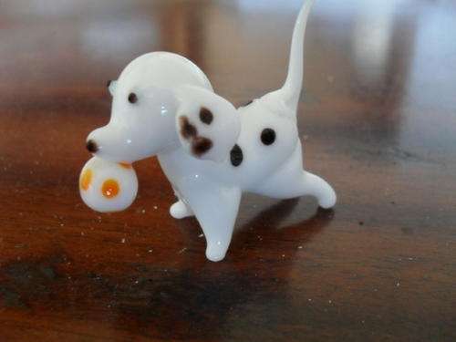 A LITTLE GLASS DALMATION  PUPPY DOG WITH BALL