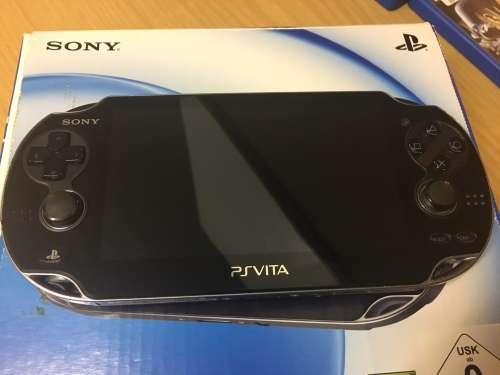 PS Vita 8GB Console and 4 games