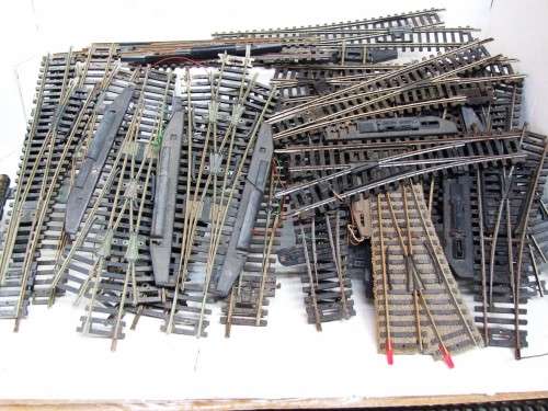 HO: 20pc Mixed Lot Turnout/ Split Track in bad used condition.It is sold as SCRAP