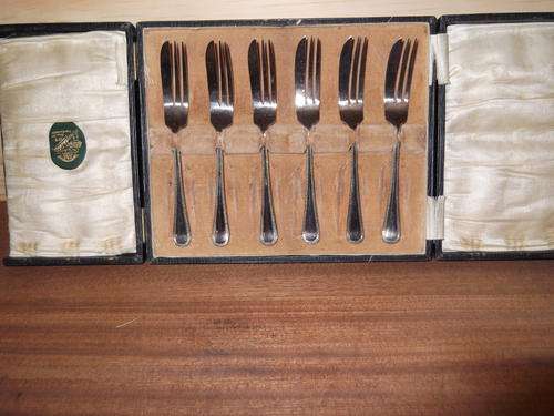 LOVELY  - IN ORIGINAL LABELED BOX, A SET OF CAKE FORKS