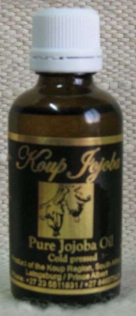50 ml Jojoba Oil in amber glass bottle with sealed cap and dripper