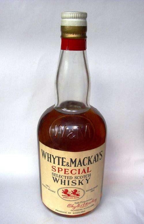 VINTAGE WHYTE & MACKAYS WHISKY BOTTLE. UNOPENED