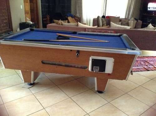 Coin operated pool table