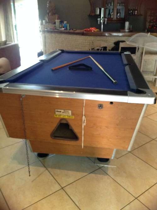 Coin operated pool table