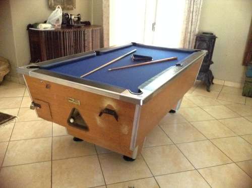 Coin operated pool table