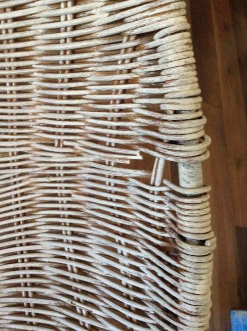 White Wicker lens shaped chair