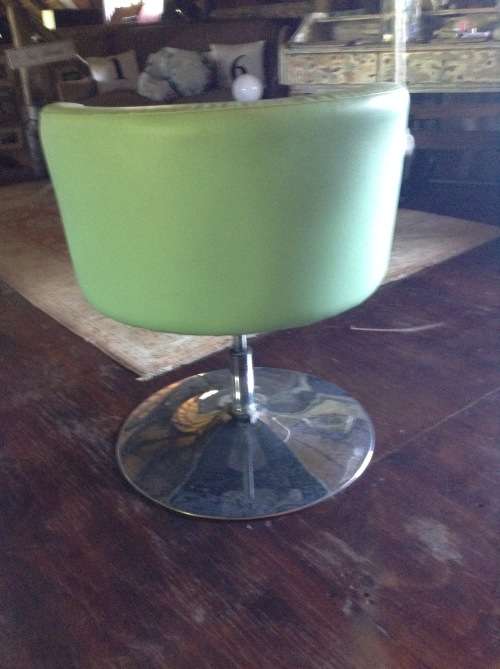 Funky retro lime green swiveling tube chair