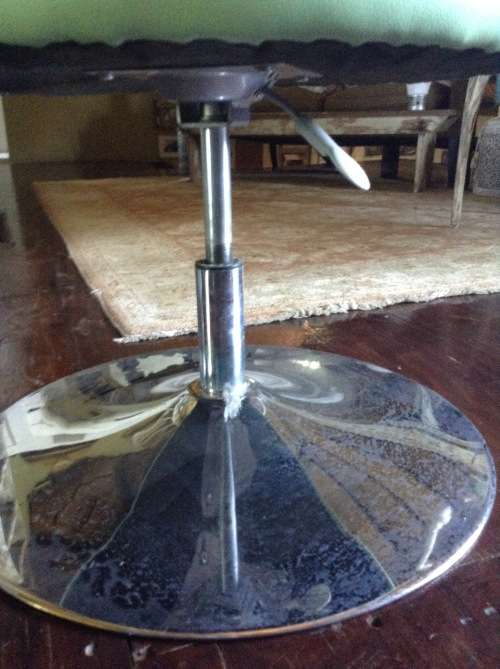 Funky retro lime green swiveling tube chair