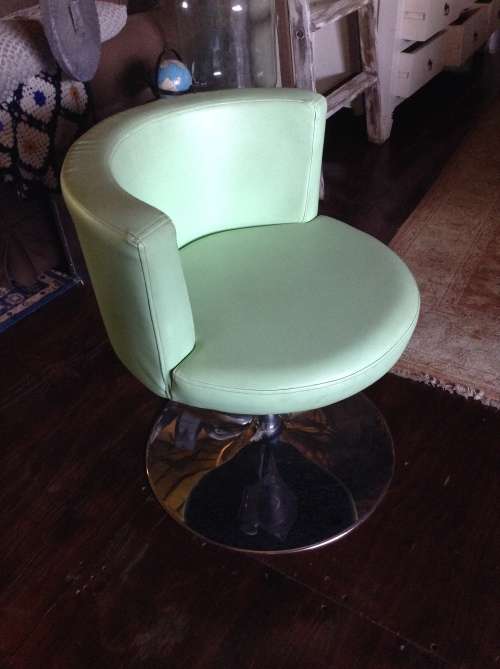 Funky retro lime green swiveling tube chair