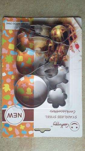 metal cookie set, dress, handbag, shoe, lipstick, perfume bottle, dog