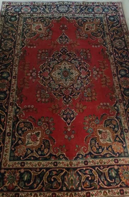 A Persian Hand Knotted Tabriz Carpet