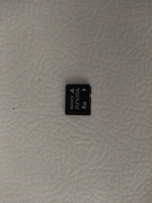 Playstation Vita, 5  PS Vita Games (In Covers) and 4GB PS Vita Memory Card with Charger