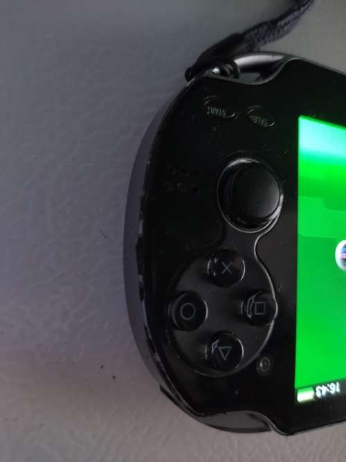 Playstation Vita, 5  PS Vita Games (In Covers) and 4GB PS Vita Memory Card with Charger