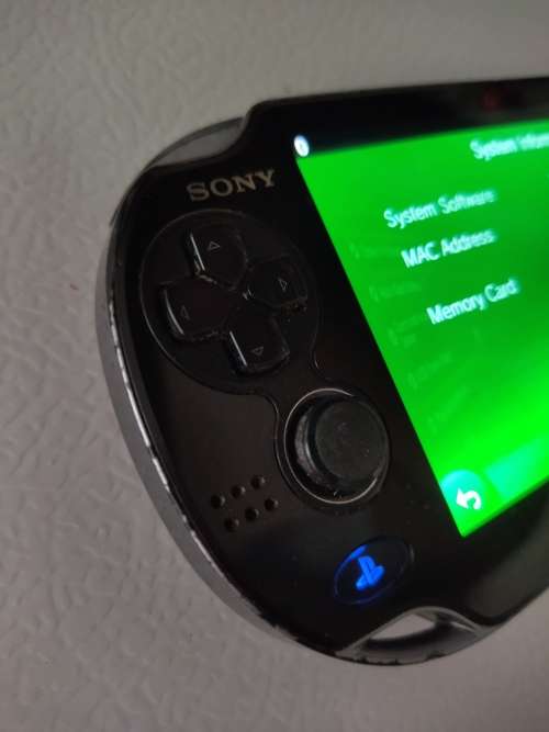 Playstation Vita, 5  PS Vita Games (In Covers) and 4GB PS Vita Memory Card with Charger