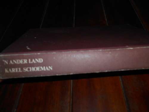 KAREL SCHOEMAN -  'N ANDER LAND  - 1984 1STE ED. HUMAN & ROSSOUW HARDEBAND