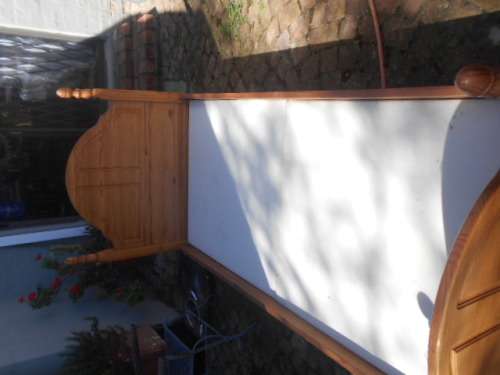 Single pine high foot and low end bed frame with 2 good condition mattresses