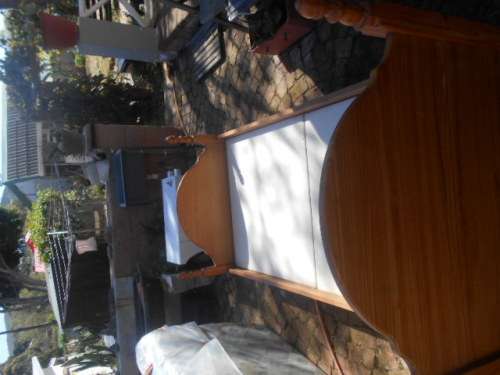 Single pine high foot and low end bed frame with 2 good condition mattresses