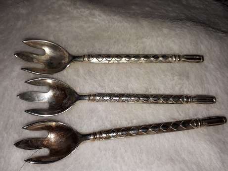 lot of old spoons and forks