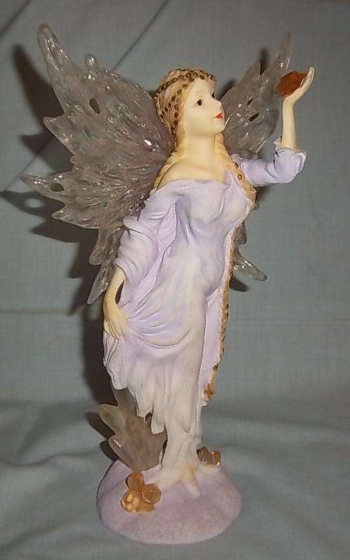 A VERY NICE FAIRY WITH A STAR IN HER HAND