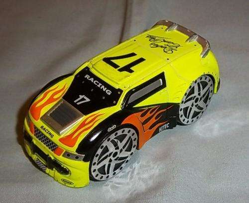 A YELLOW DIE CAST CAR BY REALTOY