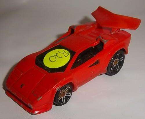 AN ORANGE LAMBORGHINI COUNTACH BY HOTWHEELS