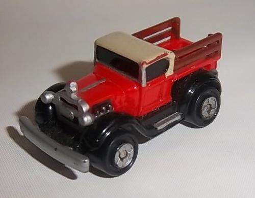 A VINTAGE ORANGE COLOURED PICK UP TRUCK BY MICRO MACHINES