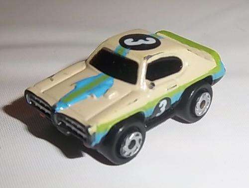 A MICRO MACHINES RACING CAR WITH NUMBER 3 DECAL