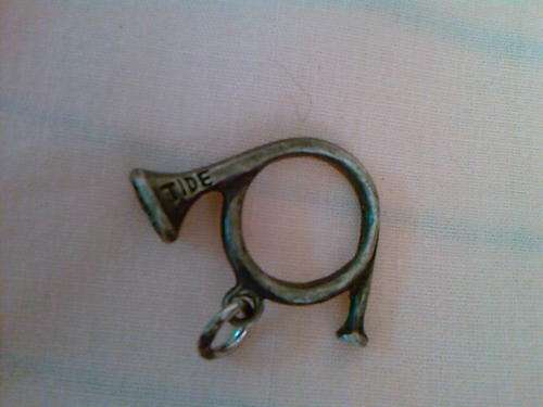 A BUGLE CHARM IN SILVER