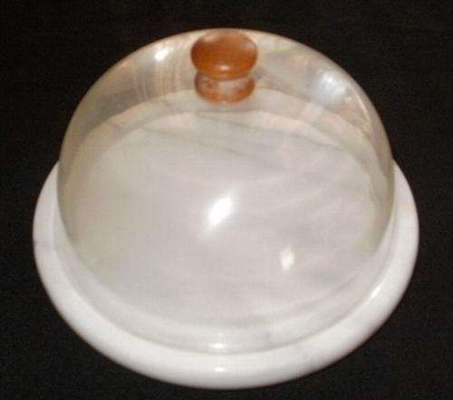 A CHEESE DISH WITH COVER