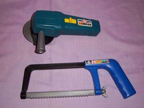 A TOY SAW AND GRINDER