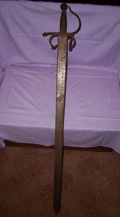 A VINTAGE SPANISH DECORATIVE SWORD STARTING AT R1