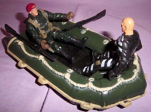 A ARMY MAN IN A BOAT WITH A PRISONER
