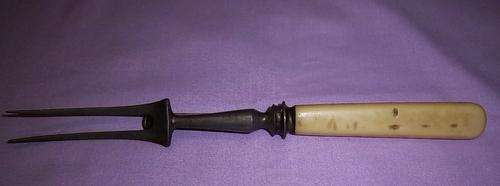 A BONE HANDLE CARVING FORK