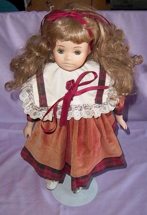 A VERY NICE PORCELAIN DOLL WITH STAND