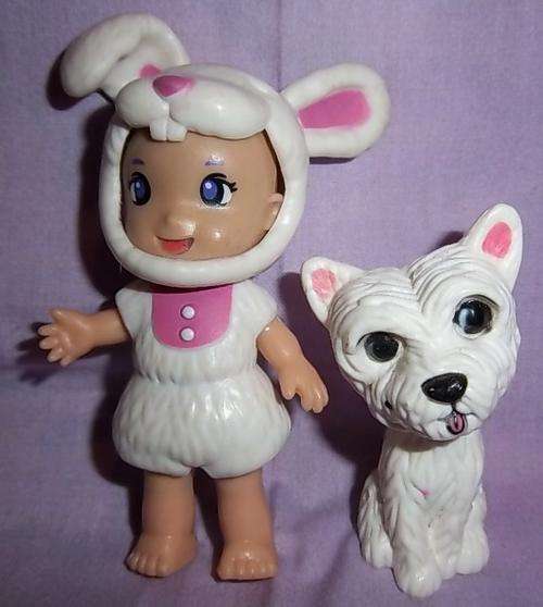A SMALL GIRL AND HER DOG, THE GIRL IS WEARING A REMOVABLE BUNNY OUTFIT