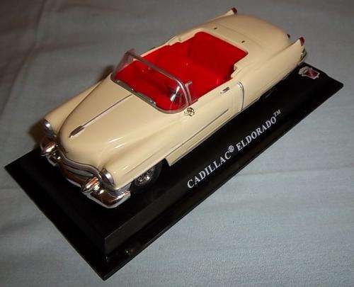 A DIE CAST CADILLAC ELDORADO MODEL ON A STAND