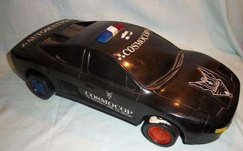 A VINTAGE COSMOCOP BATTERY POLICE CAR, LIGHTS, SOUND ETC