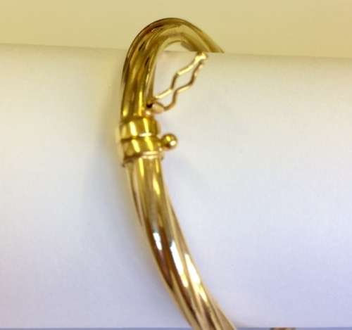 TWISTED 9CT GOLD BANGLE -  STUNNING