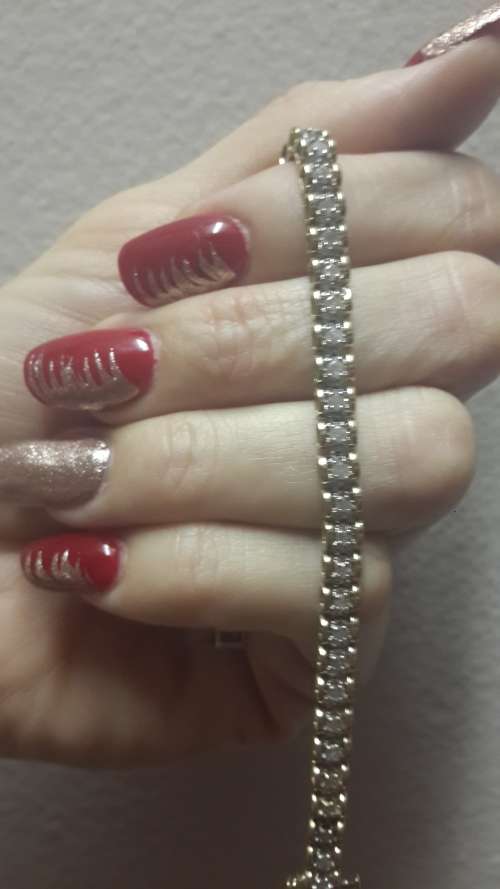 Beautiful refurbished solid 9ct yellow gold and diamond ladies tennis bracelet.