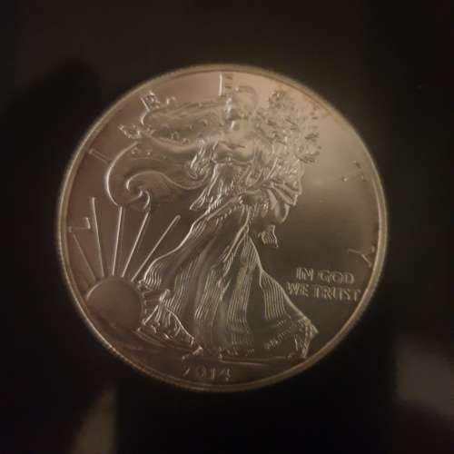 1 oz  2014 American Silver Eagle , Pure solid Silver Bullion ( 999.9%)