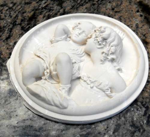 Antique style plaque of girl and baby