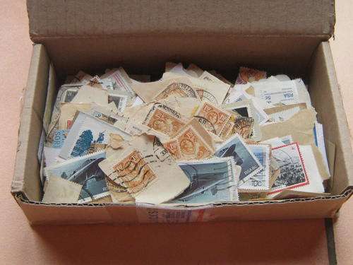 BOX WITH 100's OF STAMPS ON PAPER - FREE SHIPPING