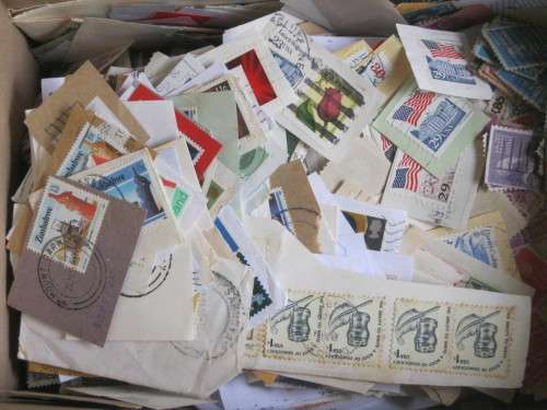 BOX OF STAMPS ON PAPER - MIXED WORLD BUT MAINLY SOUTH AFRICA
