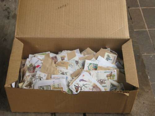 SHOEBOX FULL OF RSA STAMPS ON PAPER