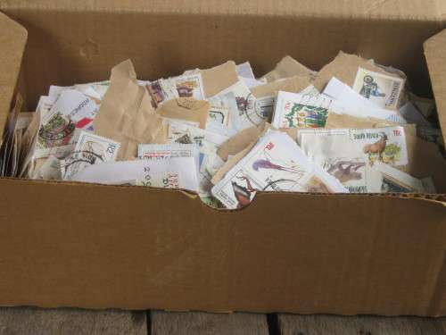 SHOEBOX FULL OF RSA STAMPS ON PAPER