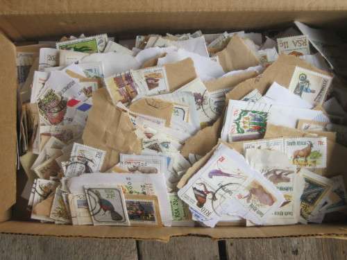 SHOEBOX FULL OF RSA STAMPS ON PAPER