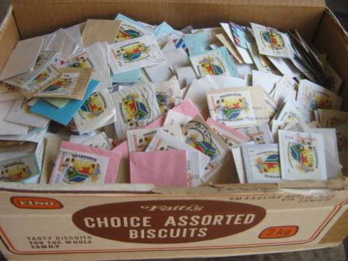 BISCUIT BOX ABOUT 90% FULL OF 1995 MASAKHANE STAMPS ON PAPER