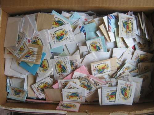 BISCUIT BOX ABOUT 90% FULL OF 1995 MASAKHANE STAMPS ON PAPER