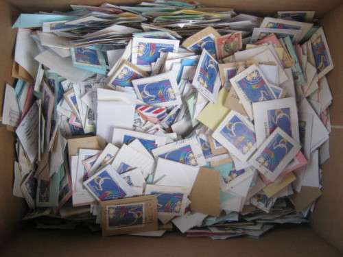 **R1 START** PAPER BOX ABOUT 60% FULL OF1995 UNITED NATIONS STAMPS ON PAPER