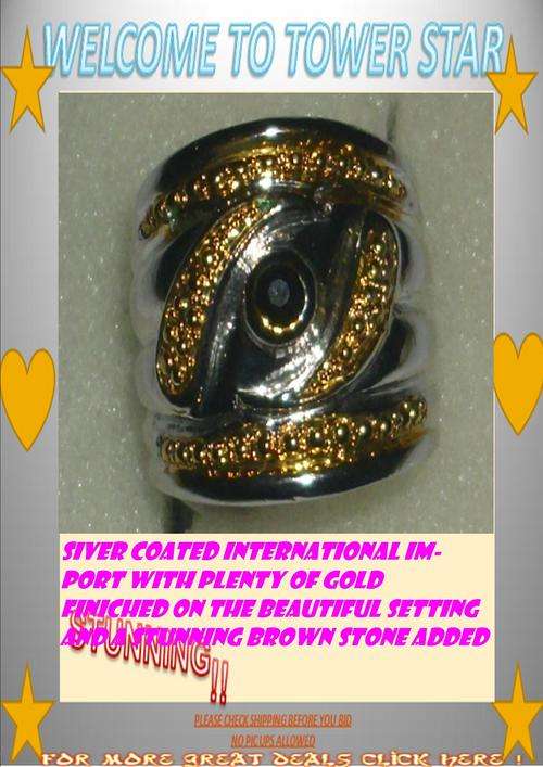 IMPORTED SILVER LOOKS LIKE 5 PIECE RING WITH GOLD ADDED AND SET WITH A BEAUTIFUL BROWN STONE SIZE20